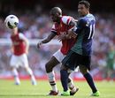 Abou Diaby is challenged by Kieran Richardson
