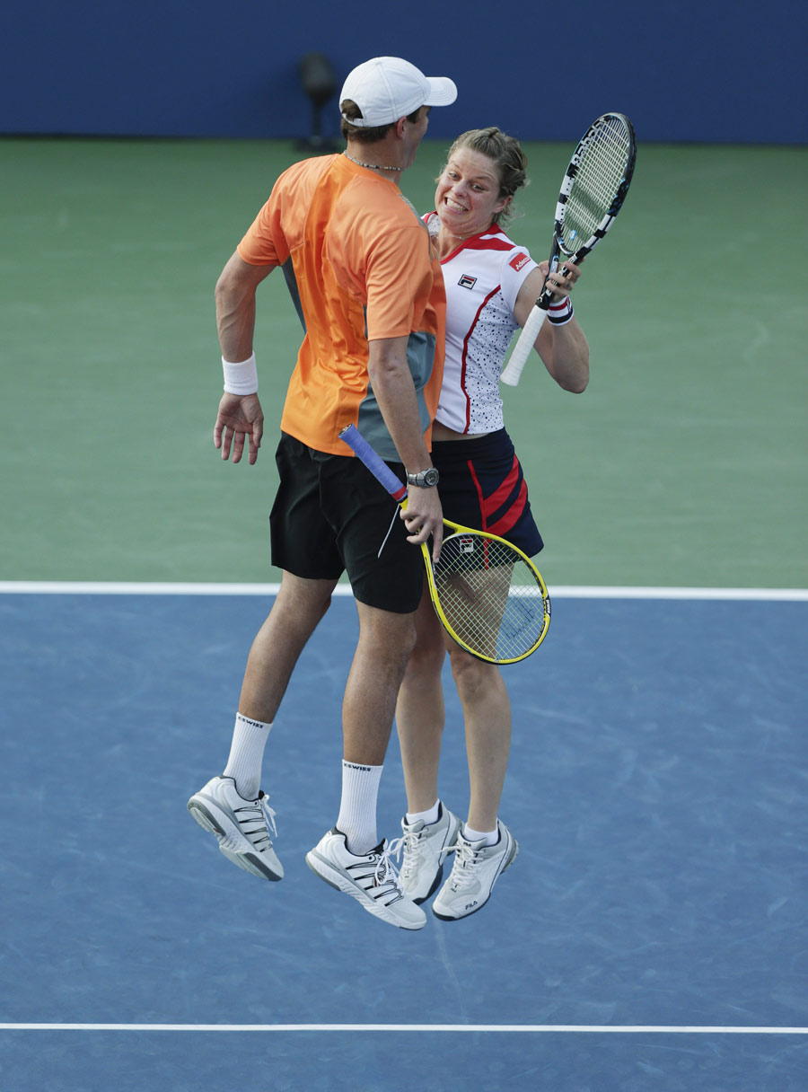 Kim Clijsters and Bob Bryan celebrate winning a point