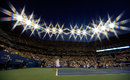 Andy Roddick prepares to serve under the lights
