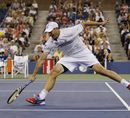 Andy Roddick lunges for a backhand