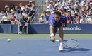 Marin Cilic stretches for a low ball
