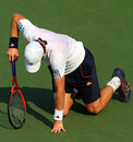 Andy Murray falls to the floor