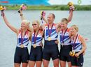 The Great Britain mixed coxed four celebrate with their medals