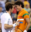 Andy Murray and Milos Raonic have a chat at the net