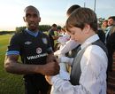 Jermain Defoe meets the fans watching a training session
