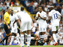 Tom Huddlestone is shown a red card by Mark Halsey