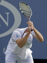 Andy Roddick waves his racket in frustration
