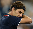 Roger Federer wipes his forehead