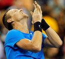 Tomas Berdych looks to the sky as he enjoys his win