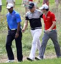 Rory McIlroy, Tiger Woods and Nick Watney head out on the 11th fairway