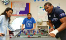 Peter Saili plays table football with young patients