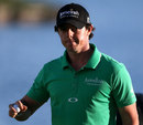 Rory McIlroy reacts to sinking a putt