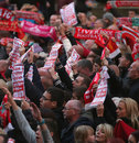 Liverpool supporters sing during an overnight vigil 