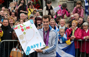 Andy Murray holds up a poster from a fan