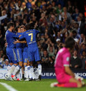 Oscar is mobbed by his team-mates as Gianluigi Buffon looks on