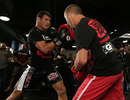 Michael Bisping pounds the pads in a UFC 152 open workout