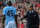 Roberto Mancini instructs Mario Balotelli