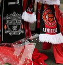 Football scarves hang alongside the Shankly Gates next to the Hillsborough Memorial