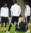 Ray Wilkins talks to Ashley Cole, John Terry and Joe Cole during a training session