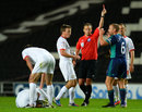 Lee Cattermole is dismissed by referee Stuart Atwell