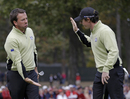 Rory McIlroy and Graeme McDowell low five