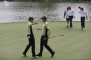 Ian Poulter and Justin Rose embrace after winning their point