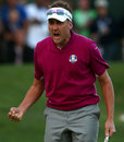 Ian Poulter gets pumped up after sinking a putt