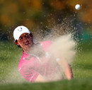 Rory McIlroy chips out of the sand