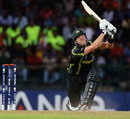 Shane Watson lofts a delivery