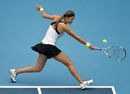 Victoria Azarenka hits a return shot to Elena Vesnina