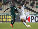 Moussa Dembele battles with Quincy