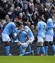 Manchester City celebrate Aleksandar Kolarov's goal