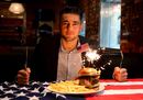Nathan Cleverly poses with a hamburger