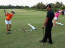 Tiger Woods takes part in a teaching clinic