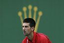 Novak Djokovic waits to receive serve