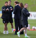Wayne Rooney waits for action during training