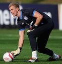 Joe Hart bowls the ball out during a training session