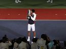 Novak Djokovic kisses the trophy after winning the men's singles match against Andy Murray 