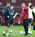 Roy Hodgson gives instructions to Steven Gerrard during an England training session
