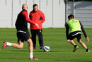 Brendan Rodgers keeps an eye on training