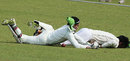 Mushfiqur Rahim and Saqlain Sajib lie on the turf after a collision 