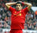 Luis Suarez reacts after missing a chance
