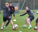 Wayne Rooney, Robin van Persie and Paul Scholes move the ball around during a training session