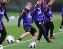 Jack Wilshere passes the ball during a training session