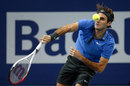 Roger Federer sends down a serve