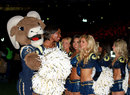 The St Louis Rams mascot dances with the team's cheerleaders
