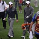 Rory McIlroy and Tiger Woods walk together