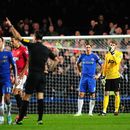 Fernando Torres stands shocked with David De Gea as he is ordered off the pitch by Mark Clattenburg