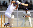 Alastair Cook drives through the covers