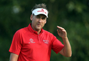 Ian Poulter gesticulates during a practice round